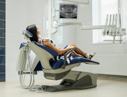 Woman leaning back in dental chair