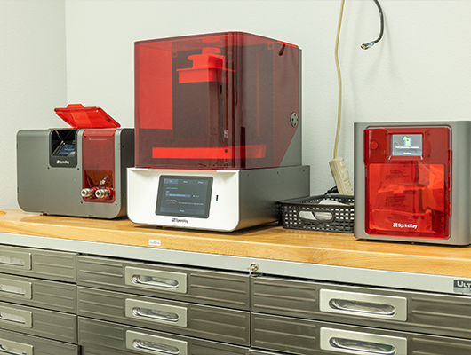 3 D printing system on desk in dental office