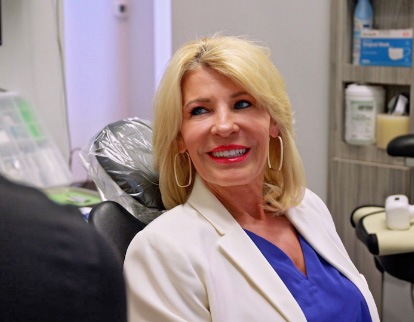 A photo of a smiling woman