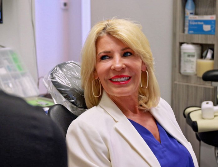 A photo of a smiling woman