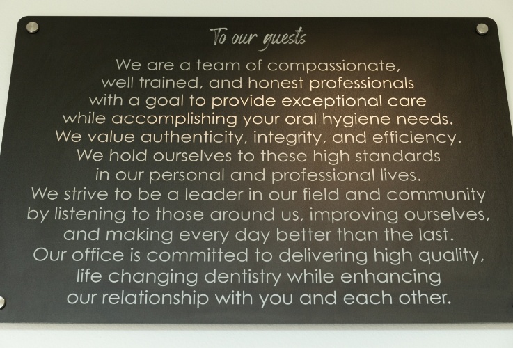 Prime Dentistry mission statement sign on wall