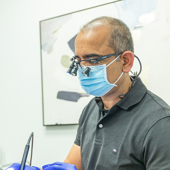 Doctor Ahir treating a patient with preventive dentistry in Denton