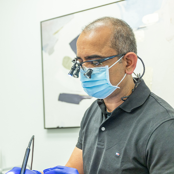 Doctor Ahir providing dental services in Denton