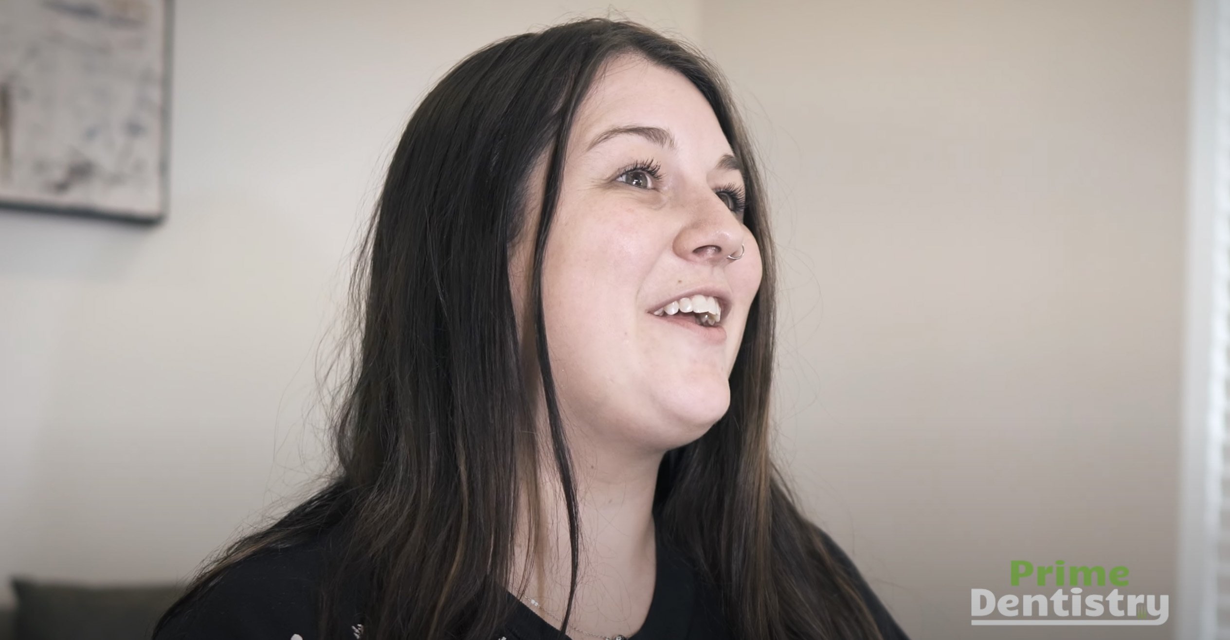 Woman with long dark hair in dental office