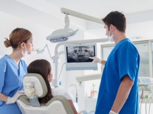 dentist pointing to a dental x-ray