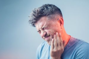 man with jaw pain