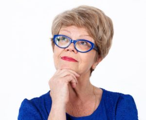 woman deciding on veneers or crowns