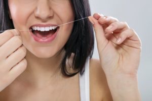 woman flossing