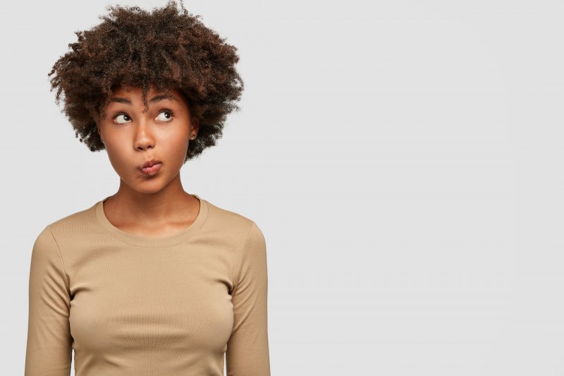 young woman with puzzled expression