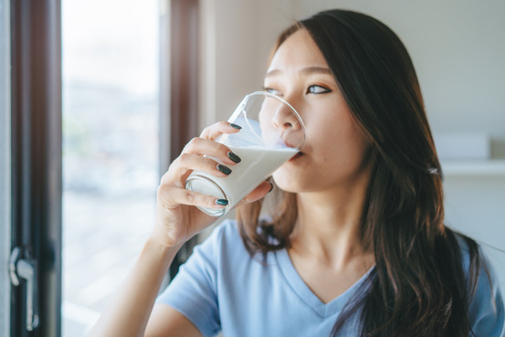 closeup of woman drinking milk