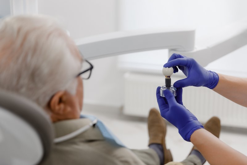 older man undergoing a dental implant consultation