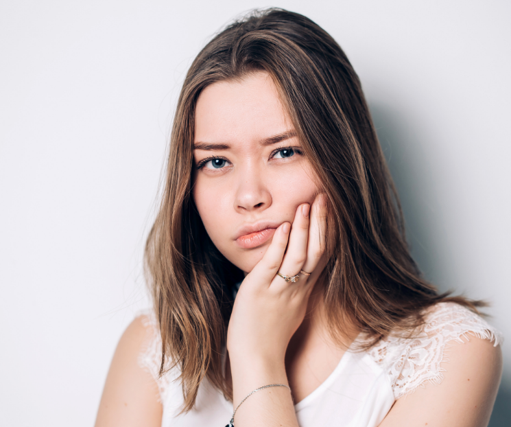 Girl holding jaw