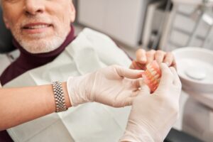 Man receiving dentures